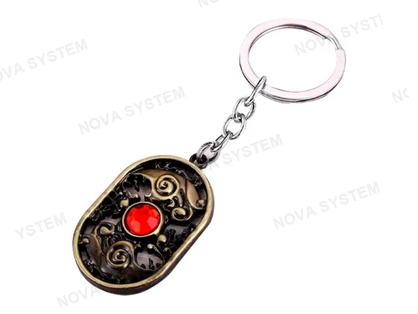LLAVERO DOTA SPIRIT RED, COLOR BRONZE, FORMA OVALADA CON 1 ESFERA ROJO INCRUSTADA 2 MOD ( SPIRIT RED )