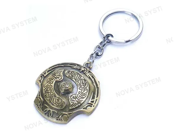 LLAVERO DOTA CHAMPION SHIELD GOLD, COLOR BRONZE, FORMA DE ESCUDO, 2 MOD ( CHAMPION SHIELD GOLD )